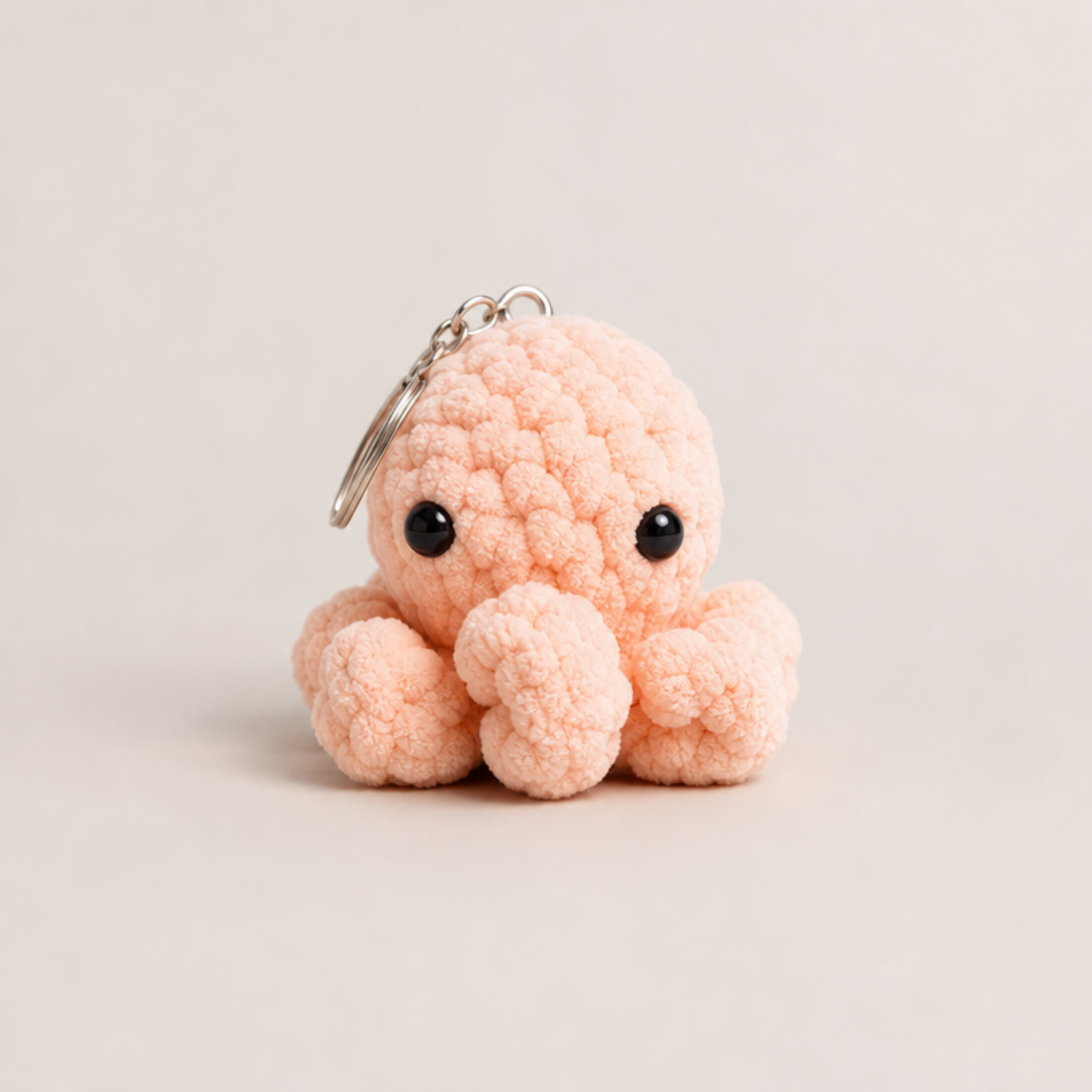Crocheted octopus keychain in baby blue